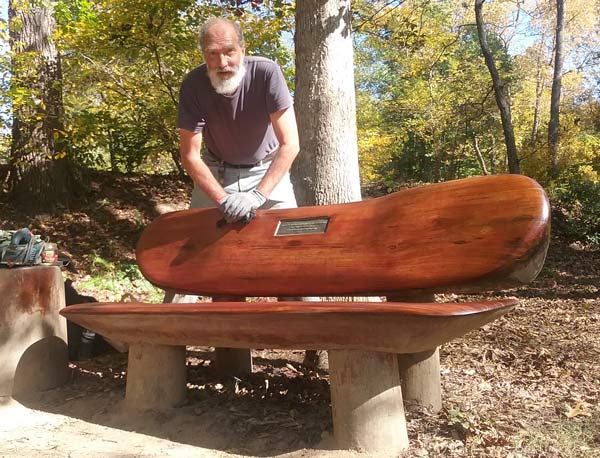 Randy Burroughs hard at work, maintaining two walnut benches he created for the Garden Club of Weaverville to donate to the City in 2011.