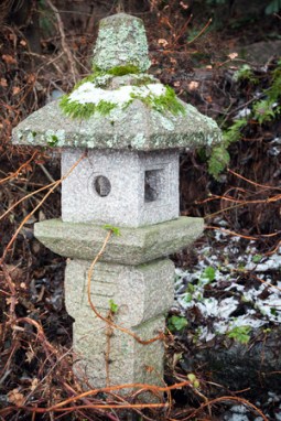 old outdoor chinese streetlight made of stone in winter park